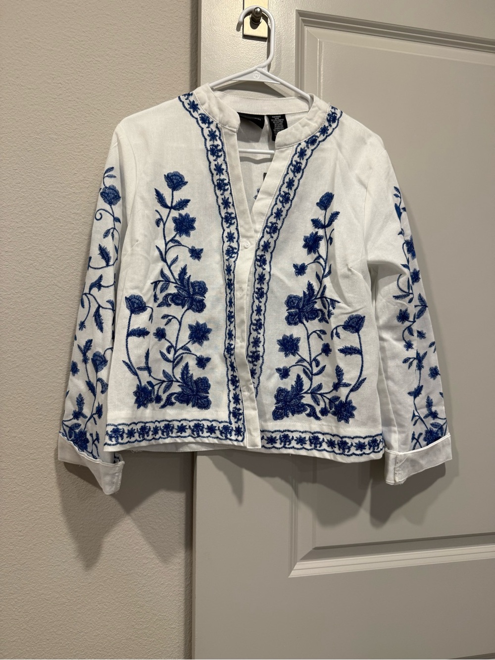 Embroidered White Jacket with Blue Floral Detail